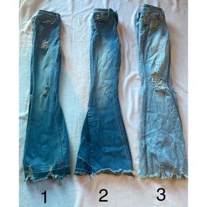 3 pairs of buckle flare jeans.